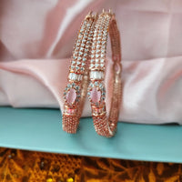 B0296_Elegant designer rose gold  bangles studded with American Diamond stones with delicate stone work.