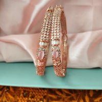 B0296_Elegant designer rose gold  bangles studded with American Diamond stones with delicate stone work.