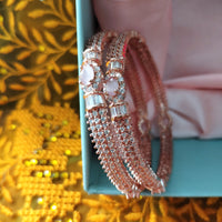 B0296_Elegant designer rose gold  bangles studded with American Diamond stones with delicate stone work.