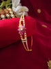 B0195_Lovely golden color bangle style flower design bracelet studded with dazzling american diamond stones with a touch of pink stones.