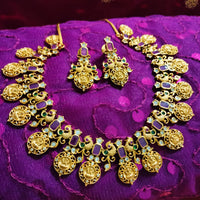 N0555_Traditional temple jewelry style Lakshmi design gold plated necklace set embellished with ruby stones .