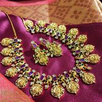 N0555_Traditional temple jewelry style Lakshmi design gold plated necklace set embellished with ruby stones .