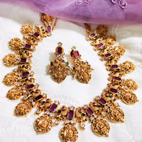 N0555_Traditional temple jewelry style Lakshmi design gold plated necklace set embellished with ruby stones .