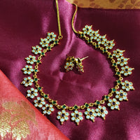 N0554_Elegant temple jewelry style flower design gold plated necklace set embellished with ruby stones .