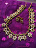 N0554_Elegant temple jewelry style flower design gold plated necklace set embellished with ruby stones .