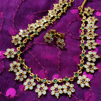 N0554_Elegant temple jewelry style flower design gold plated necklace set embellished with ruby stones .