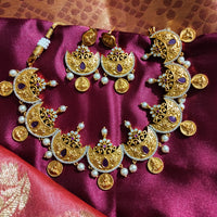 N0556_Classic temple jewelry style Lakshmi design gold plated necklace set embellished with ruby stones with a touch of pearls.