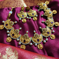 N0556_Classic temple jewelry style Lakshmi design gold plated necklace set embellished with ruby stones with a touch of pearls.