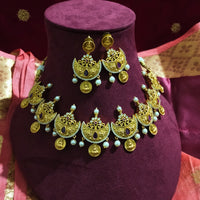 N0556_Classic temple jewelry style Lakshmi design gold plated necklace set embellished with ruby stones with a touch of pearls.