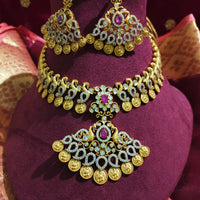 N0553_Grand temple jewelry style Lakshmi design gold plated necklace set embellished with ruby stones .
