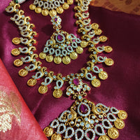 N0553_Grand temple jewelry style Lakshmi design gold plated necklace set embellished with ruby stones .