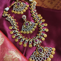 N0553_Grand temple jewelry style Lakshmi design gold plated necklace set embellished with ruby stones .