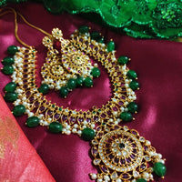 N0551_Grand designer gold plated necklace set embellished with ruby stones with green  bead drops.