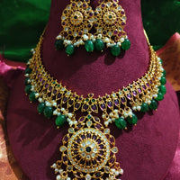 N0551_Grand designer gold plated necklace set embellished with ruby stones with green  bead drops.