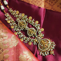 N0552_Grand designer lakshmi design gold plated necklace set embellished with ruby stones with a touch of bead drops.