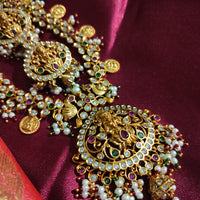 N0552_Grand designer lakshmi design gold plated necklace set embellished with ruby stones with a touch of bead drops.