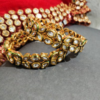 B0283_Classy Ethnic screw design bangles with delicate work of kundan stones.
