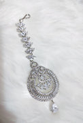 M030_Classy tear drop design American diamond studded Maang tika with delicate stone work.