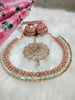 N0574_Elegant designer rose gold american diamond embellished necklace set with a touch of light green colour stones.
