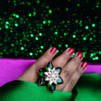 R065_Gorgeous flower design American Diamond studded statement ring studded with a touch of green stones.