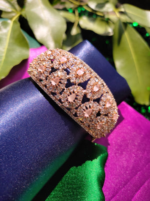 B0318_Grand Designer bracelets studded with delicate work of american diamond stones with a touch of  pink stone.