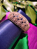 B0318_Grand Designer bracelets studded with delicate work of american diamond stones with a touch of  pink stone.