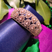 B0318_Grand Designer bracelets studded with delicate work of american diamond stones with a touch of  pink stone.