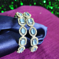 B0319_ Royal style Silver plated bangles studded with  American Diamond stones with a touch of blue stones.