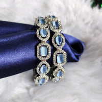 B0319_ Royal style Silver plated bangles studded with  American Diamond stones with a touch of blue stones.