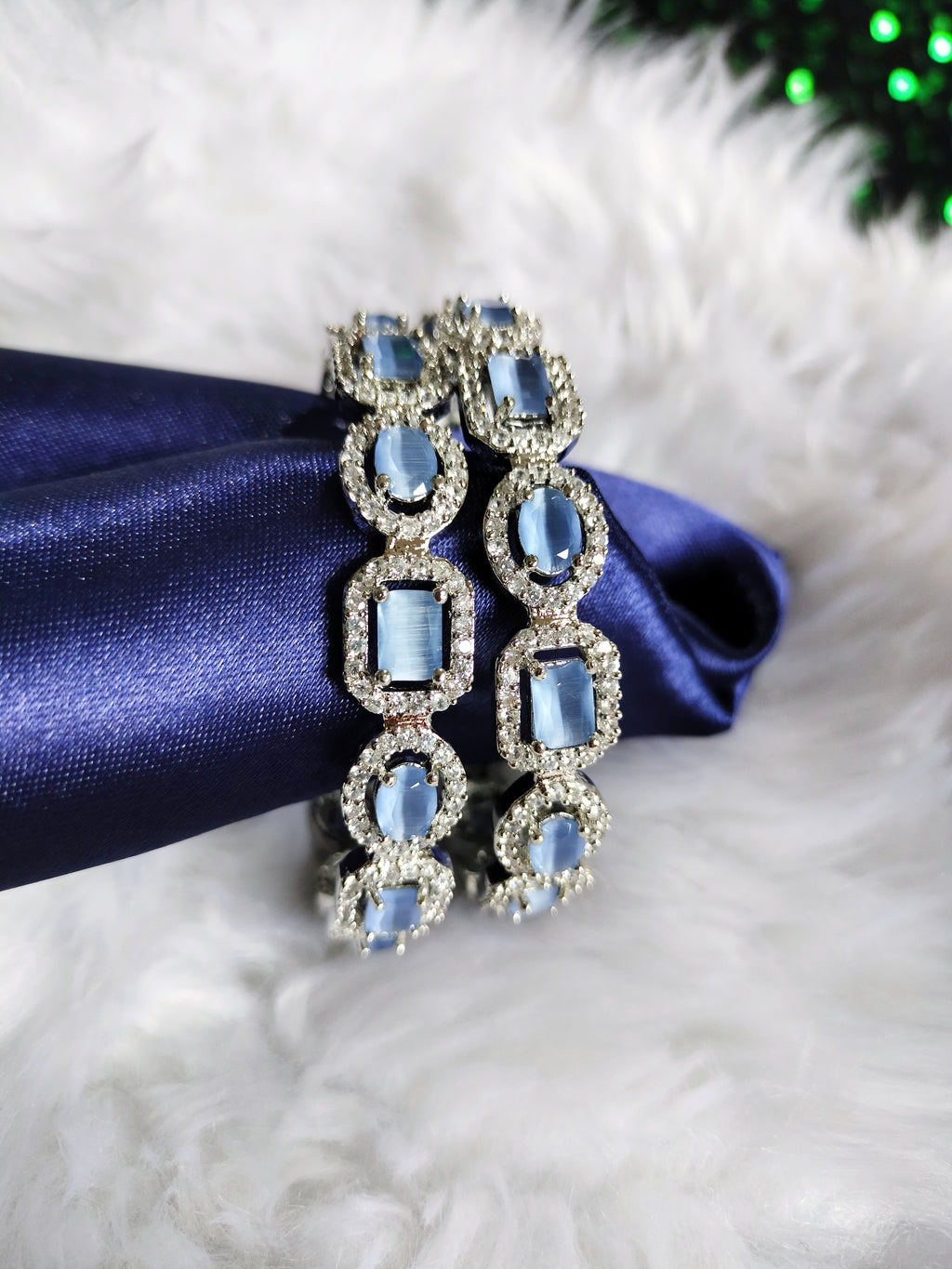 B0319_ Royal style Silver plated bangles studded with  American Diamond stones with a touch of blue stones.