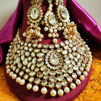 N0584_Royal Bridal style Elaborated choker necklace set studded with Kundan stones with a touch of glossy pearls.