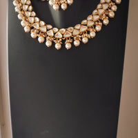 N0585_Royal Bridal style choker necklace set studded with Kundan stones with a touch of glossy pearls.
