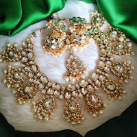 N0587_Royal Bridal style Elaborated choker necklace set studded with Kundan stones with a touch of glossy pearls.