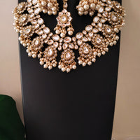 N0587_Royal Bridal style Elaborated choker necklace set studded with Kundan stones with a touch of glossy pearls.