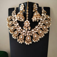 N0587_Royal Bridal style Elaborated choker necklace set studded with Kundan stones with a touch of glossy pearls.