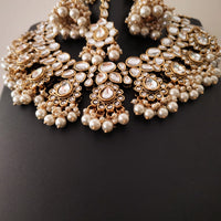 N0587_Royal Bridal style Elaborated choker necklace set studded with Kundan stones with a touch of glossy pearls.