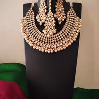N0588_Royal Bridal style Elaborated choker necklace set studded with Kundan stones with a touch of glossy pearls.