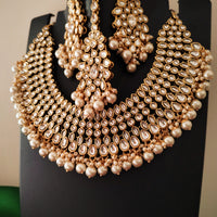 N0588_Royal Bridal style Elaborated choker necklace set studded with Kundan stones with a touch of glossy pearls.