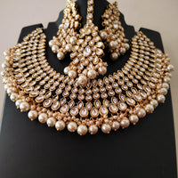 N0588_Royal Bridal style Elaborated choker necklace set studded with Kundan stones with a touch of glossy pearls.