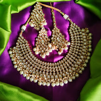 N0588_Royal Bridal style Elaborated choker necklace set studded with Kundan stones with a touch of glossy pearls.