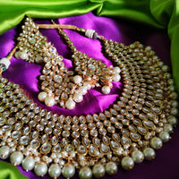 N0588_Royal Bridal style Elaborated choker necklace set studded with Kundan stones with a touch of glossy pearls.