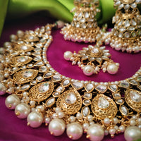 N0591_Royal Bridal style Elaborated choker necklace set studded with Kundan stones with a touch of glossy pearls.