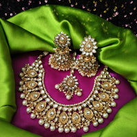N0591_Royal Bridal style Elaborated choker necklace set studded with Kundan stones with a touch of glossy pearls.