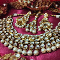 N0592_Royal designer choker necklace set studded with Kundan stones with a touch of glossy pearls.