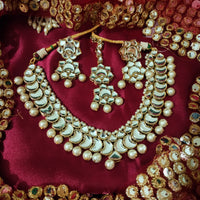 N0593_Gorgeous designer choker necklace set studded with Kundan stones with a touch of glossy pearls.