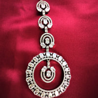 M036_Classy ciccular design American diamond studded Maang tika with delicate stone work.