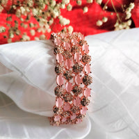 B0300_S_ Exquisite Rose Gold plated bangles with delicate art work studded with  American Diamond stones.