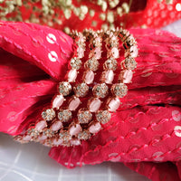 B0300_S_ Exquisite Rose Gold plated bangles with delicate art work studded with  American Diamond stones.