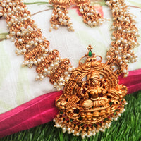 N0558_Classic temple jewelry style Lakshmi design gold plated necklace set embellished with ruby stones with a touch of pearls.
