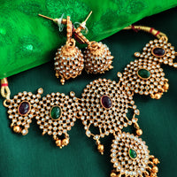 N0557_Classic temple jewelry style flower design gold plated necklace set embellished with ruby stones with a touch of pearls.